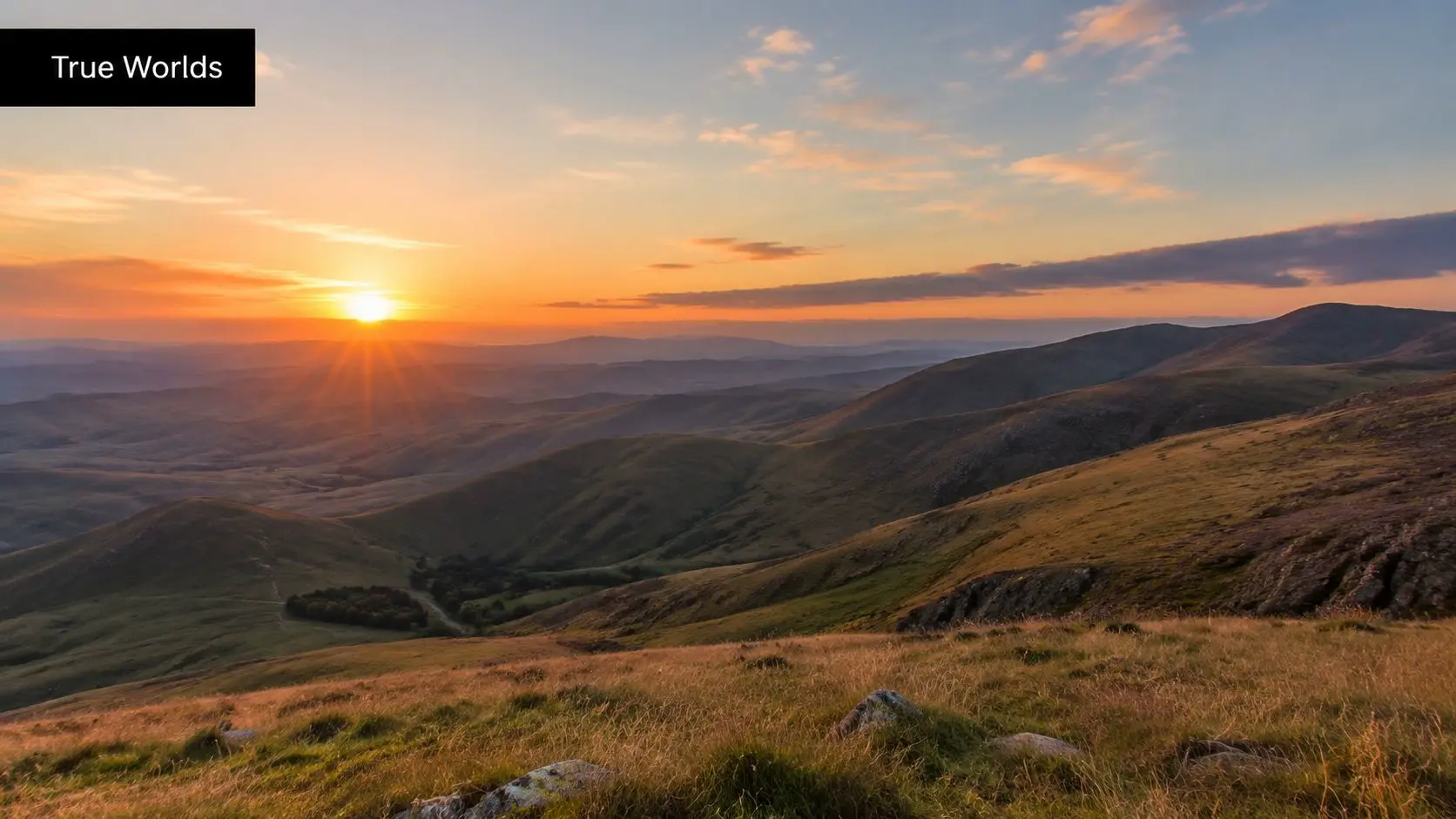 A breathtaking golden sunset over rolling mountain hills during the warm, peaceful hour of twilight.