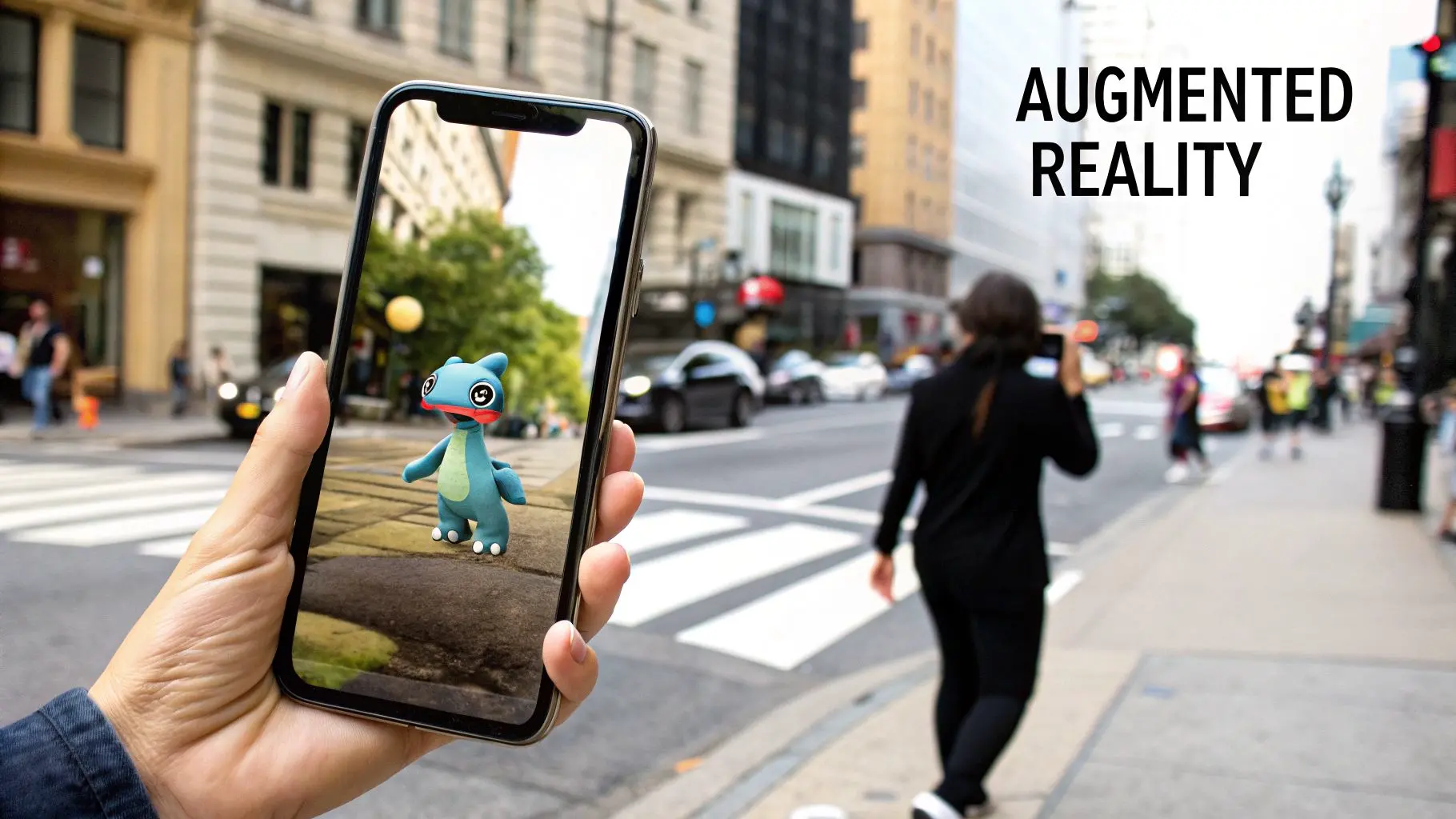 A hand holds a smartphone displaying a blue creature in an augmented reality game on a city street.