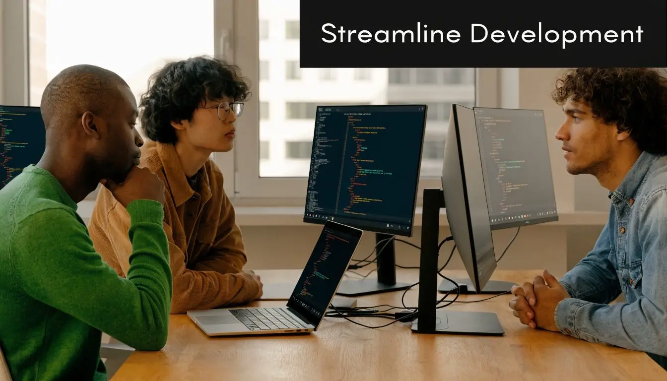 A team of diverse software developers collaborating on code at a wooden table in an office.